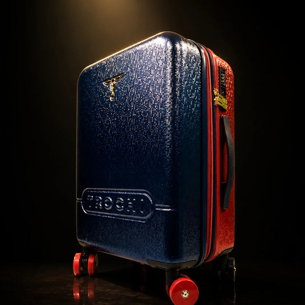 TROCHI Gold Line luggage collection premium carry-on in dramatic black and gold studio lighting